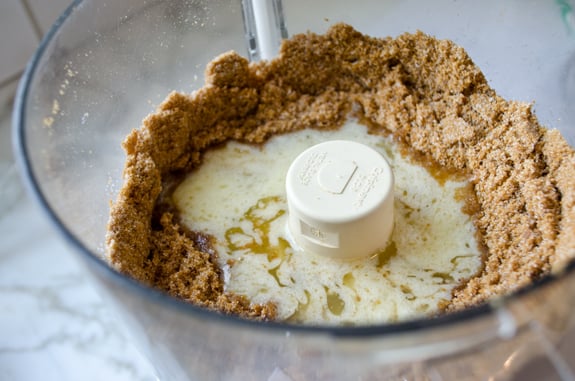adding-butter-to-crumbs