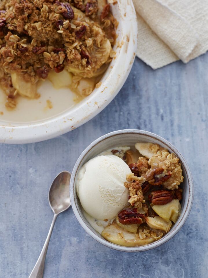 Apple Crisp and ice cream in a bowl.