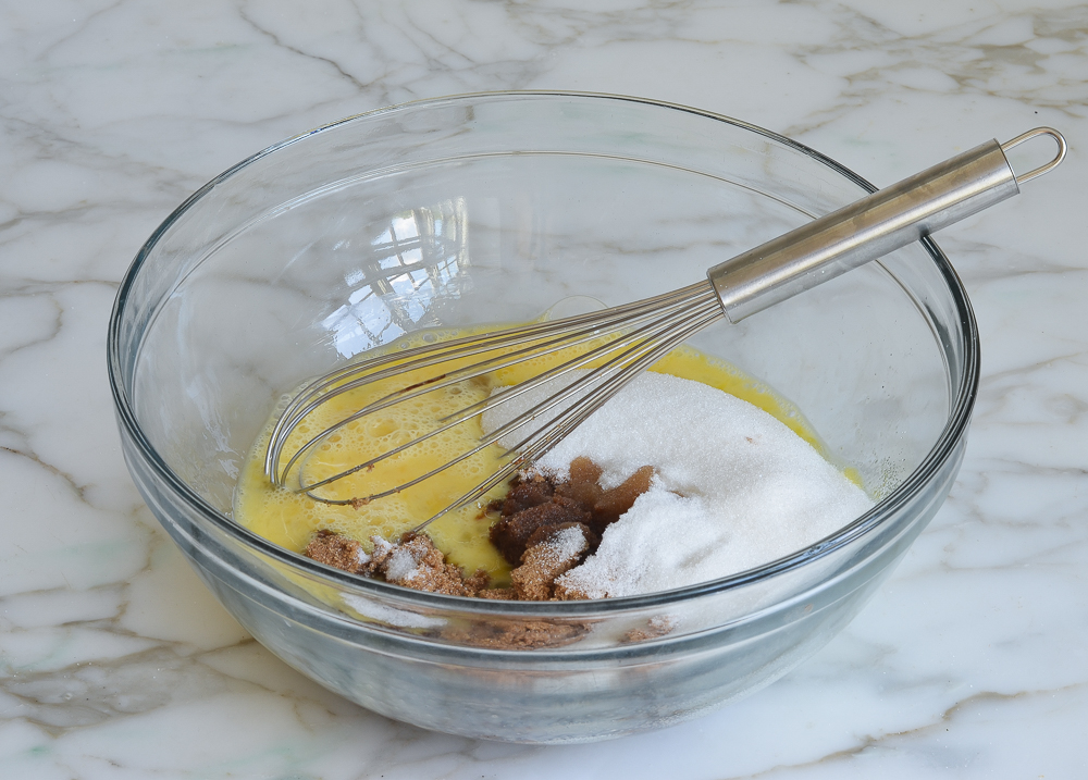 eggs, sugars, and flavorings in mixing bowl