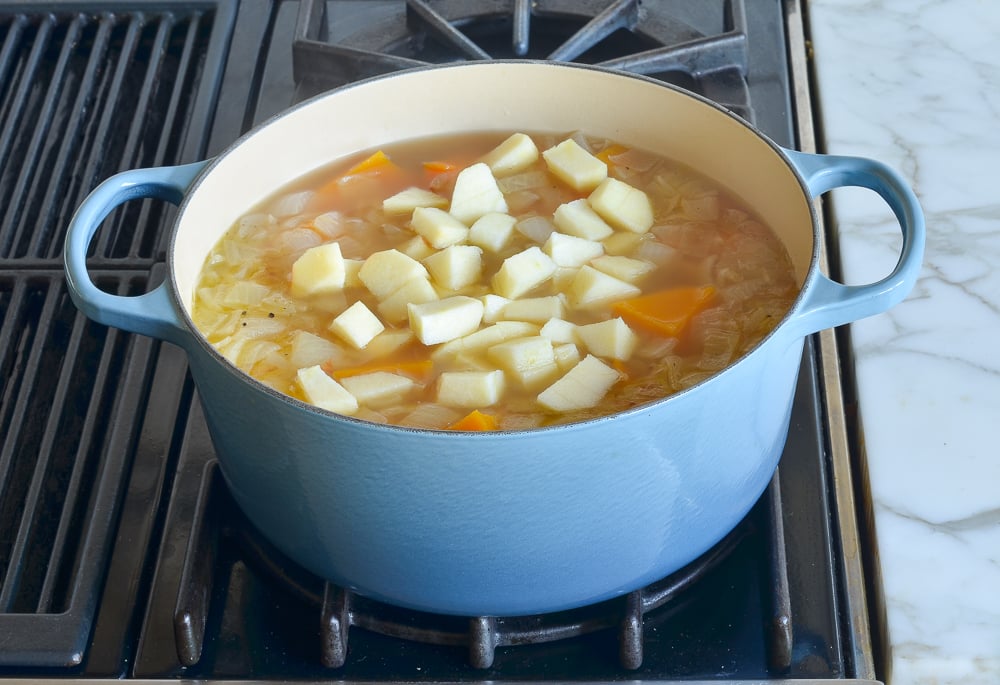 Apples floating in soup.