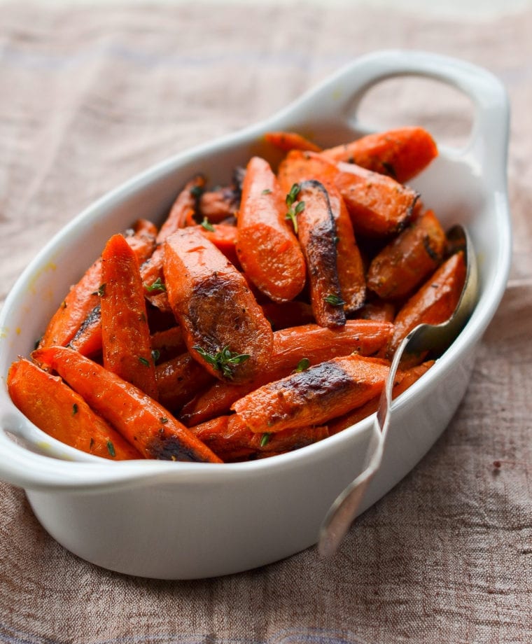 Serving dish of roasted carrots.