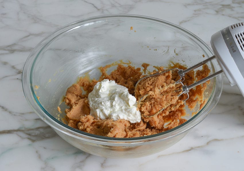 Whipped cream in a bowl with peanut butter filling.