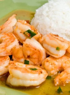 Plate of Thai-style ginger and sweet red chili shrimp with rice.