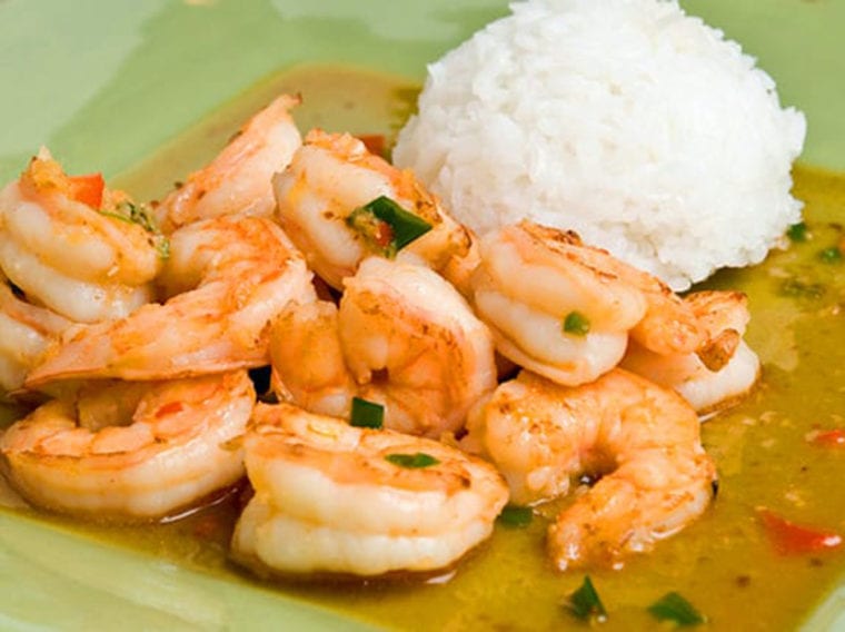 Plate of Thai-style ginger and sweet red chili shrimp with rice.