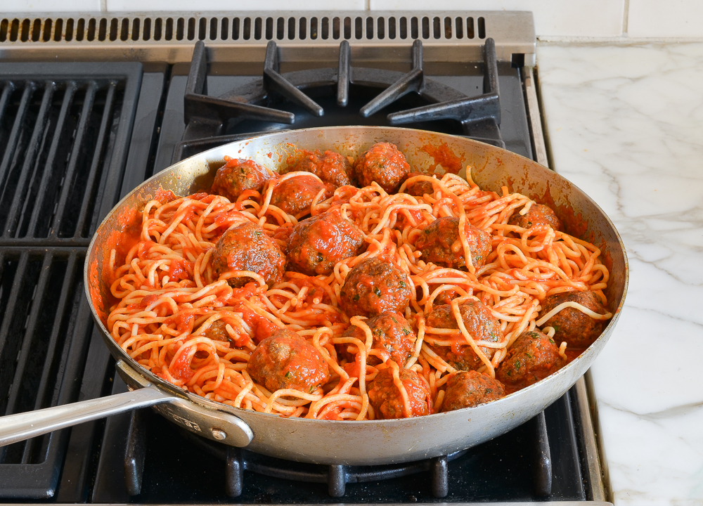 spaghetti and meatballs in skillet