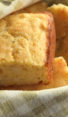Pieces of savory cornbread with cheddar and thyme in a basket.