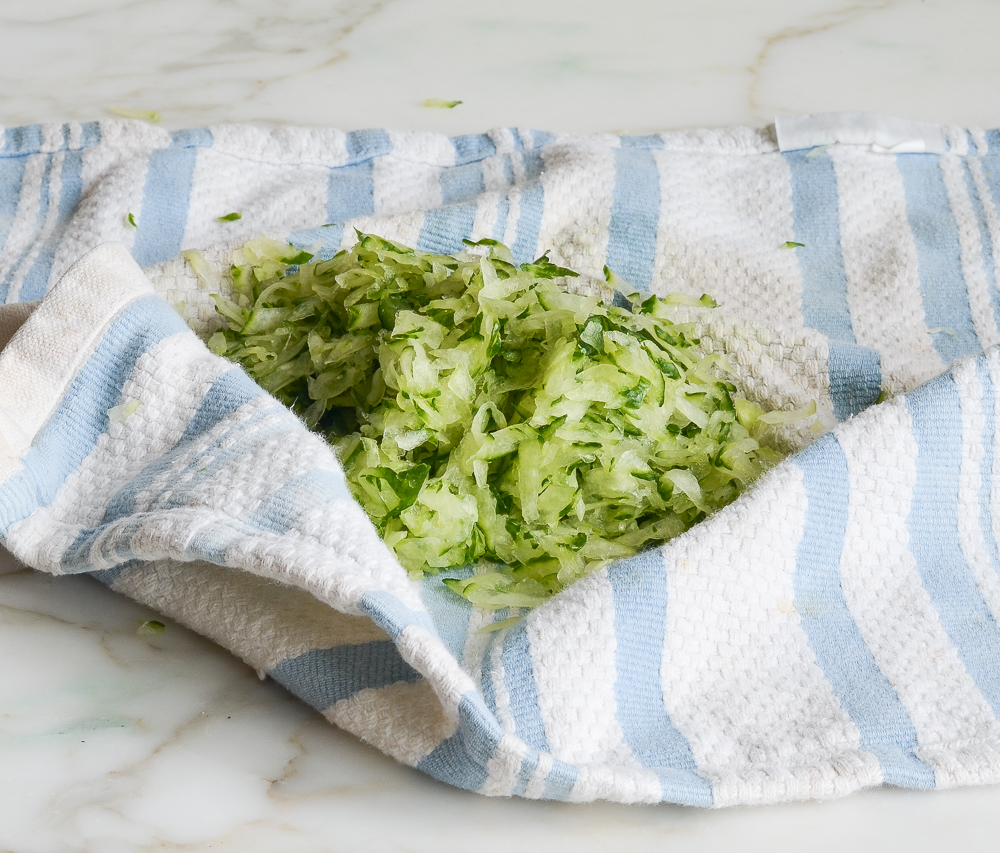 shredded cucumber wrapped in dish towel
