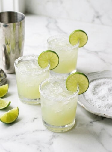 Margarita cocktails garnished with lime slices