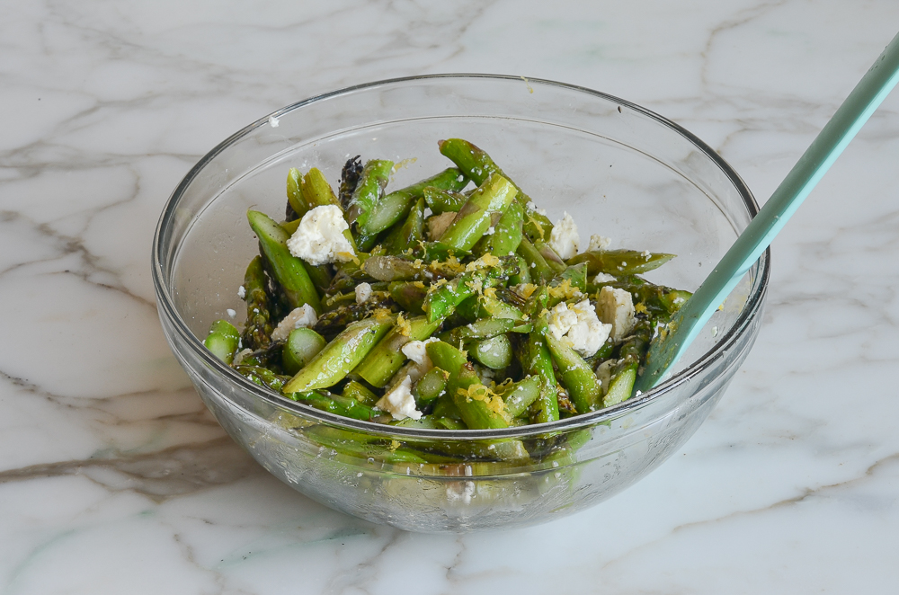 finished grilled asparagus salad in mixing bowl