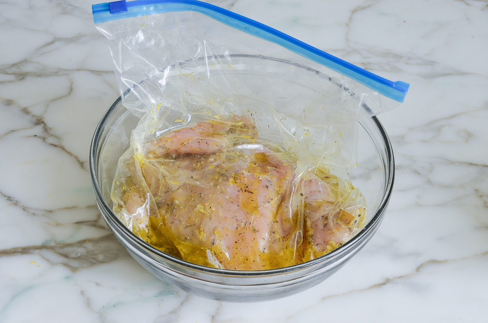 sealed chicken in bowl ready to marinate in the fridge