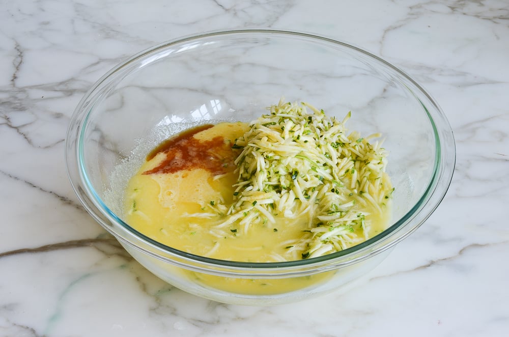 adding butter, zucchini and vanilla to egg mixture