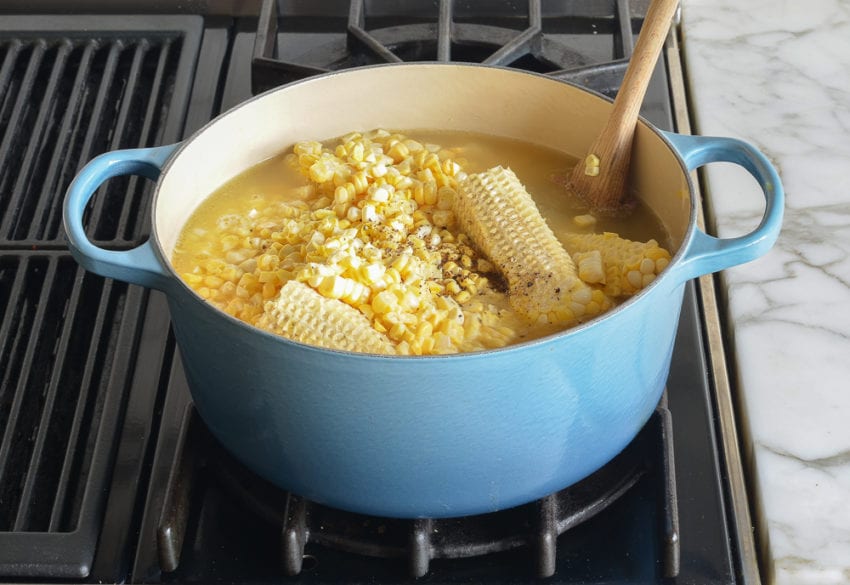 Corns in a pot with broth.