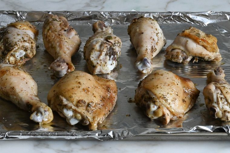 baked chicken on foil-lined baking sheet
