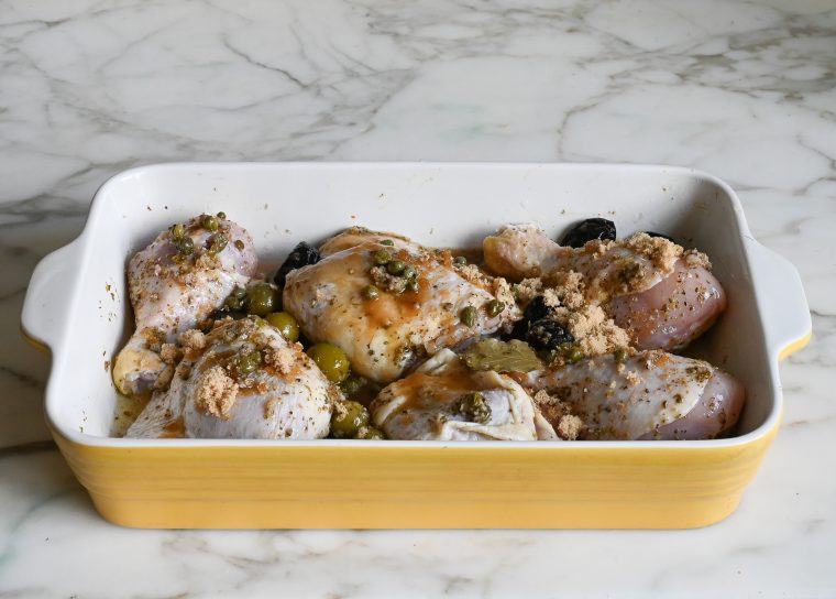 chicken in baking dish sprinkled with brown sugar and wine