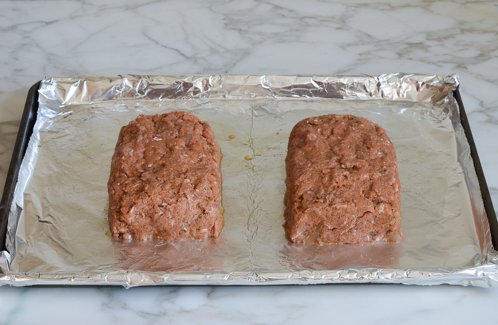 free-form turkey meatloaves on baking sheet