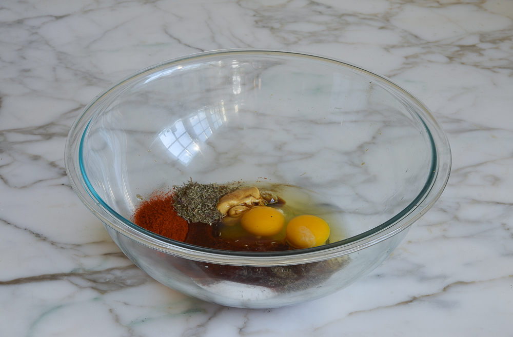 seasoning and eggs in mixing bowl for turkey meatloaf