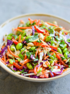 Bowl of colorful Asian slaw with ginger peanut dressing.