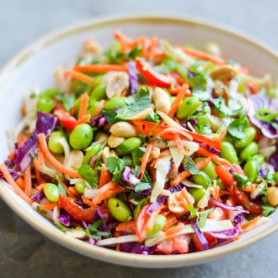 Bowl of colorful Asian slaw with ginger peanut dressing.