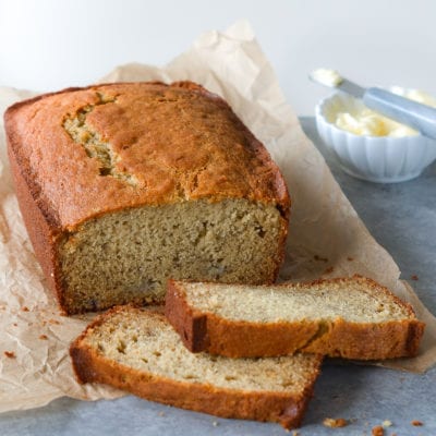 Partially-sliced loaf of banana bread.