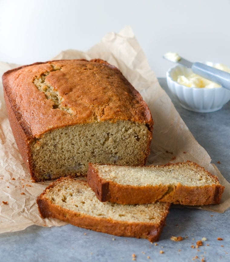 Partially-sliced loaf of banana bread.