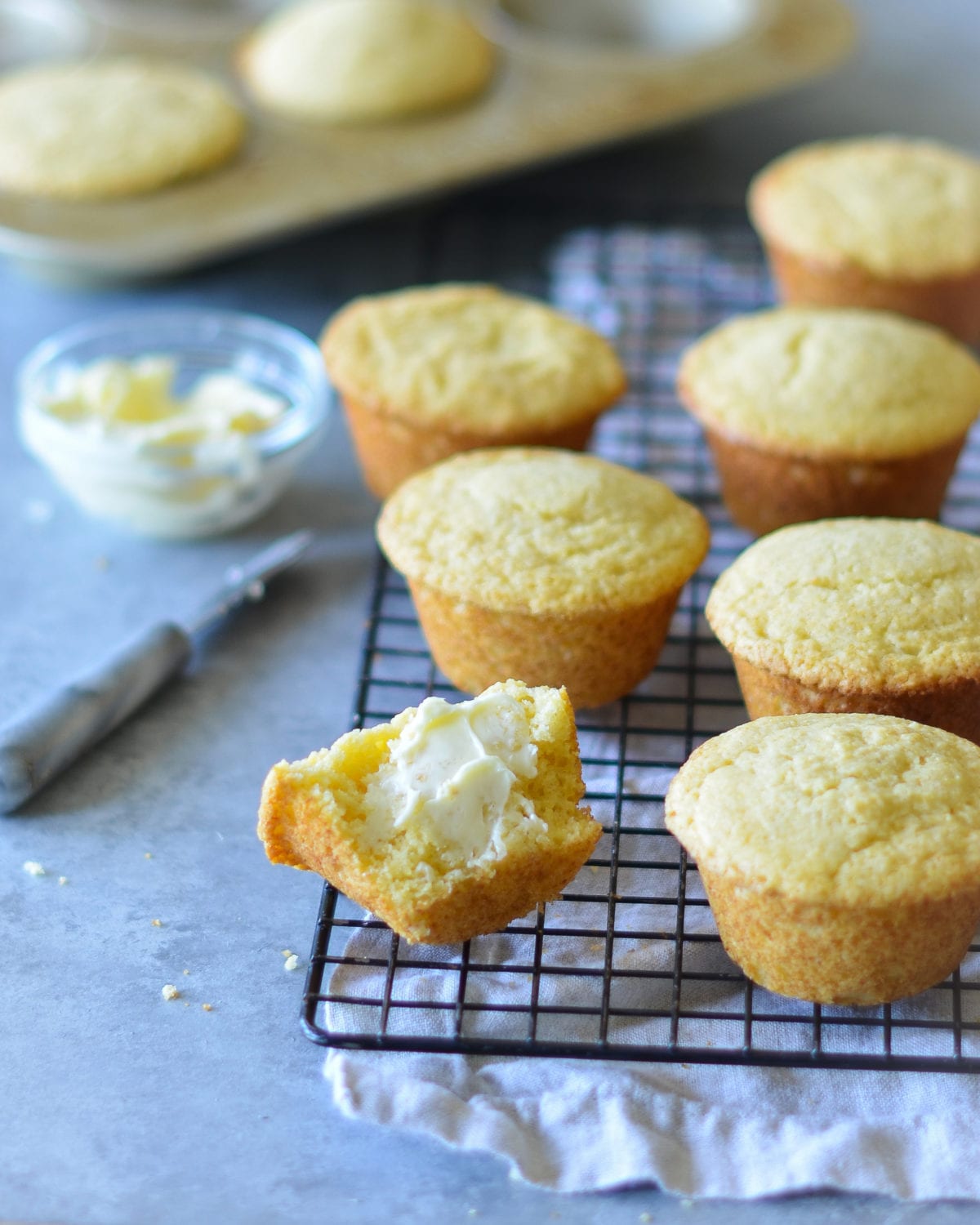 Cornbread muffins on a wire rack.