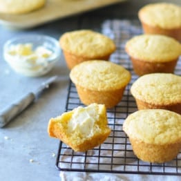 Cornbread muffins on a wire rack.