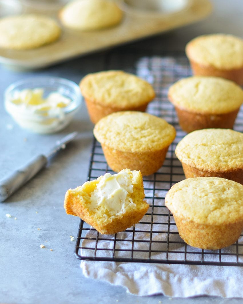 Cornbread muffins on a wire rack.