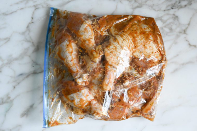 chicken marinading in bag