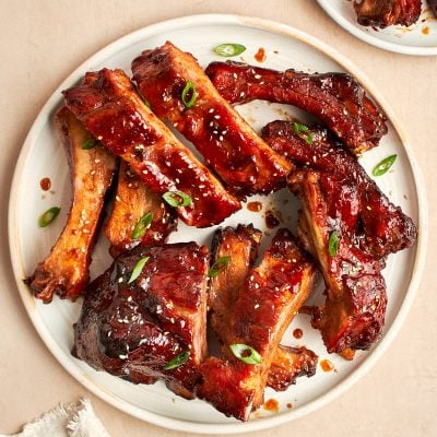 baby back ribs with hoisin bbq sauce on white plate.