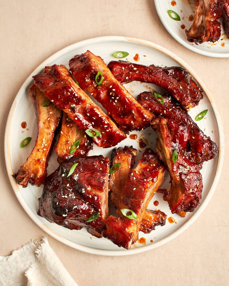 baby back ribs with hoisin bbq sauce on white plate.