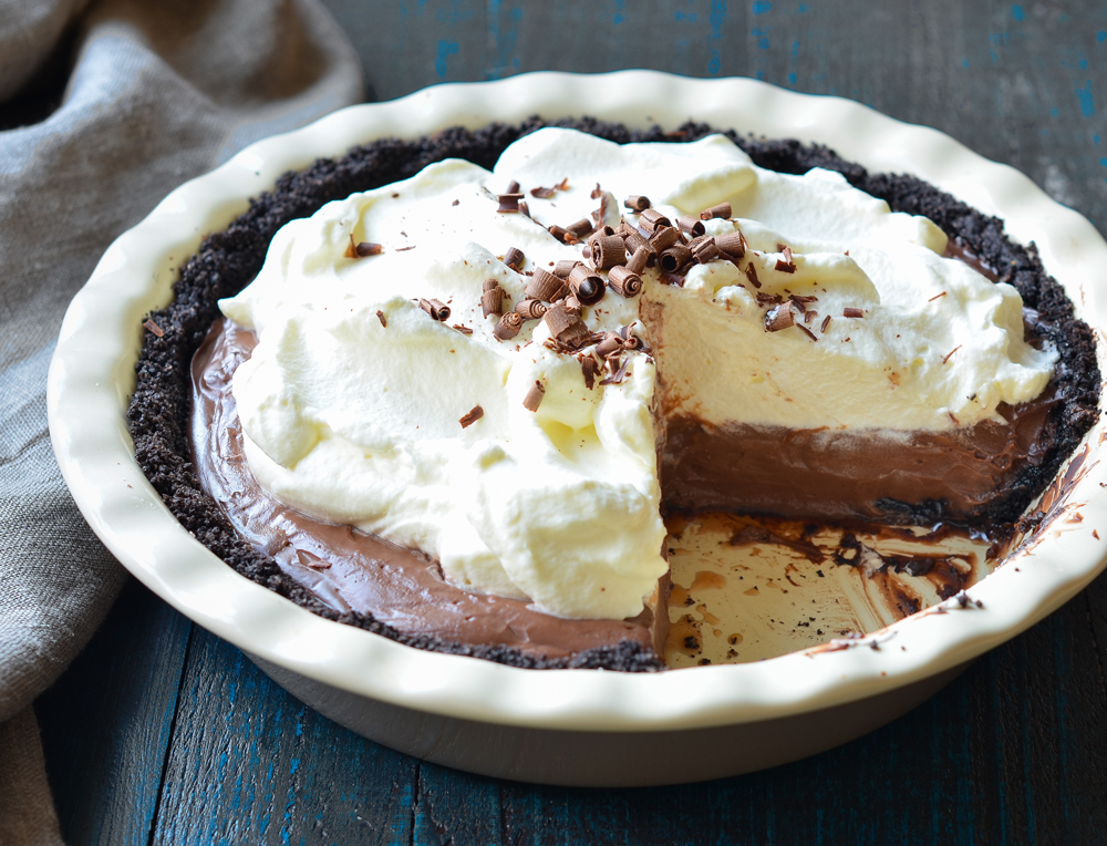 Oreos and butter finely chopped and combined in bowl of food processor