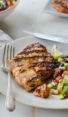 Grilled tequila lime chicken on a plate with salad.