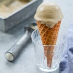 Caramelized banana ice cream cone in a glass.