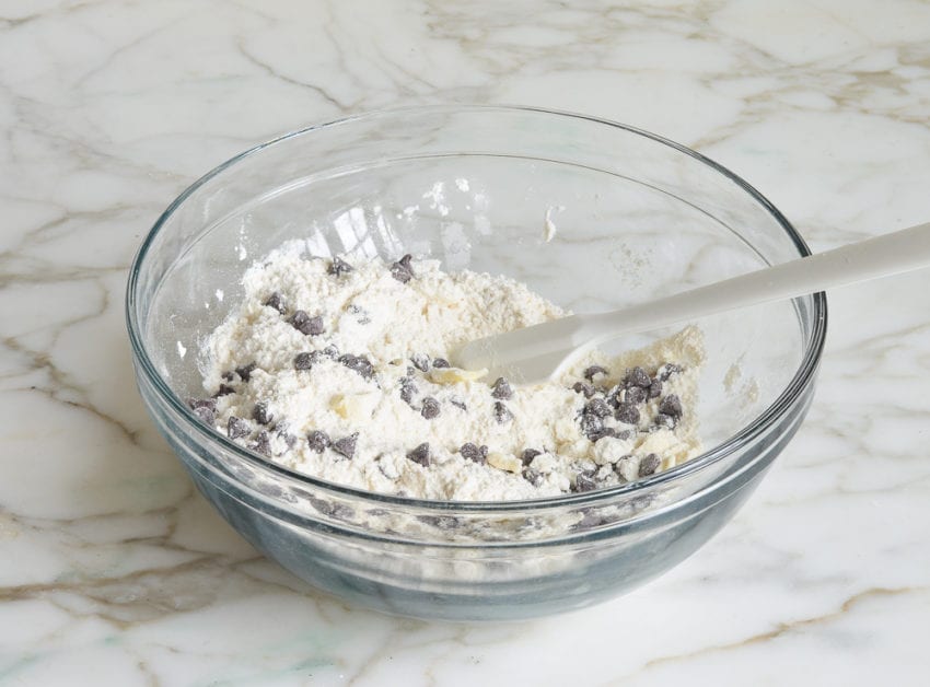 butter, flour and chocolate chips in mixing bowl for making chocolate chip scones