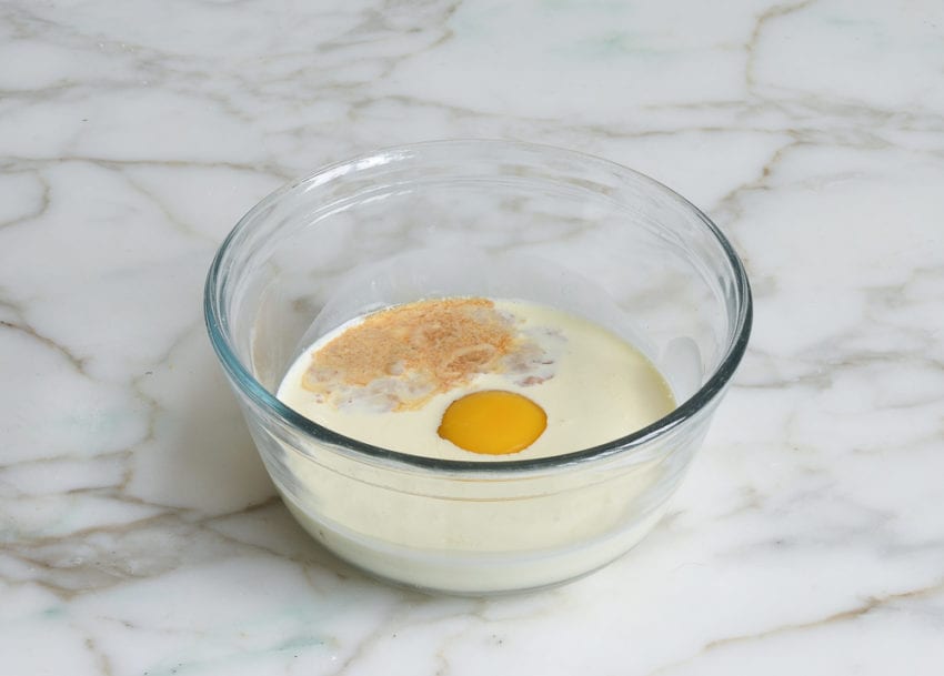 cream, egg, and vanilla in mixing bowl for making chocolate chip scones