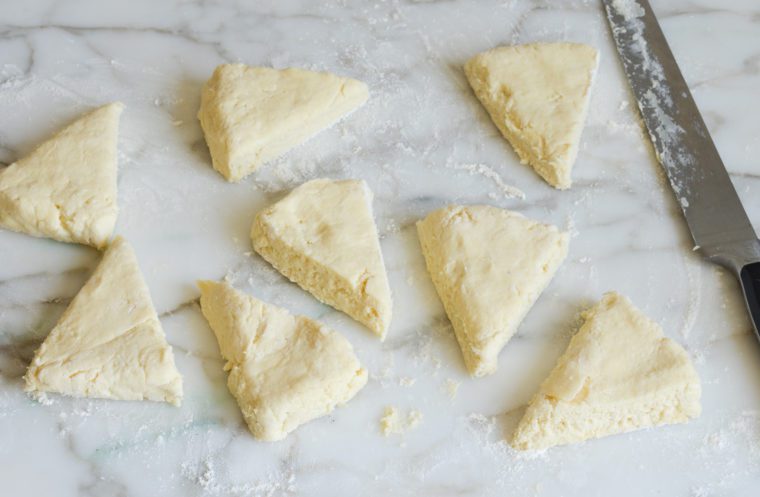 scone triangles on marble board.