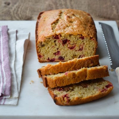 Cranberry Orange Bread on cutting board.