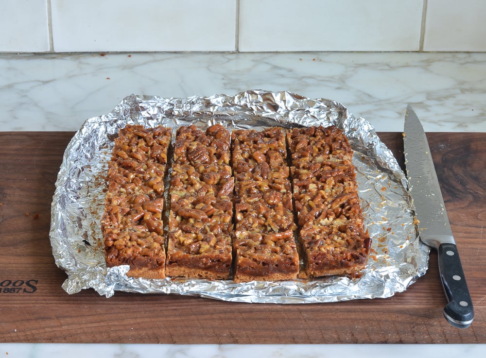 Cut pecan squares on foil.