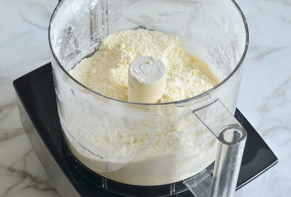 Coarse butter and flour mixture in a food processor.