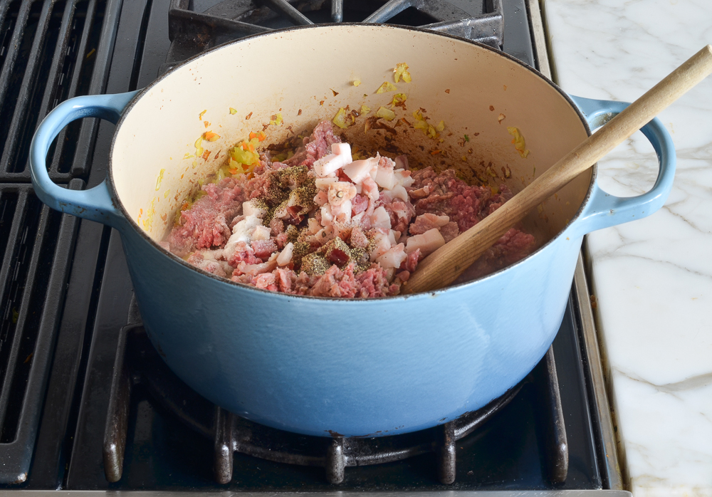 adding beef and pancetta to the pot