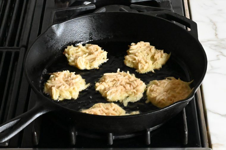 frying latkes in skillet