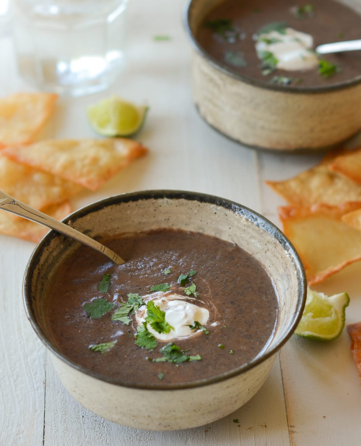 Spoon in a bowl of black bean soup.