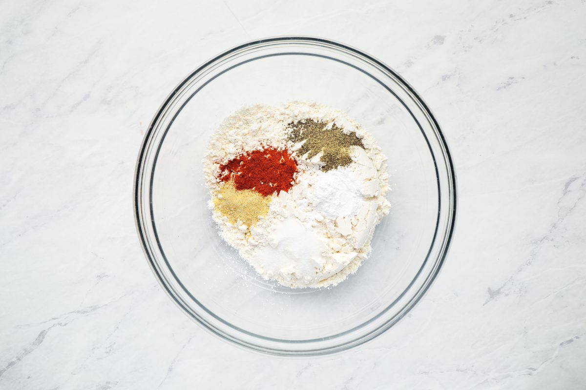 Flour, baking powder, and spices in bowl.
