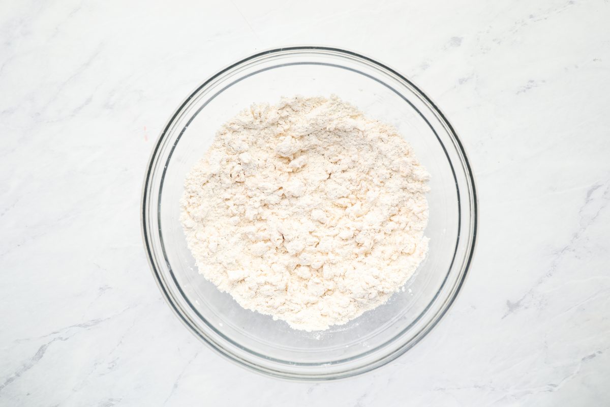 Bowl of clumpy coating for fried chicken tenders.