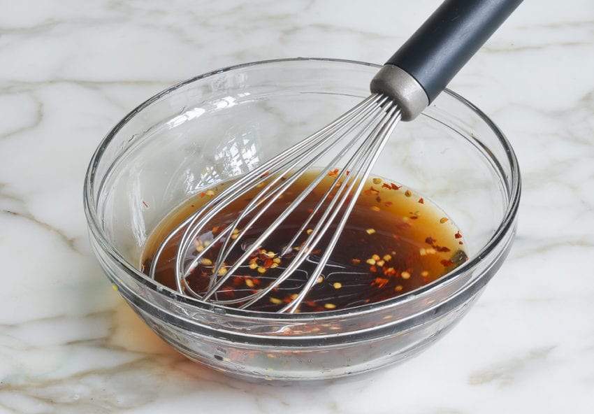 Whisk in a bowl of fish sauce and seasonings.