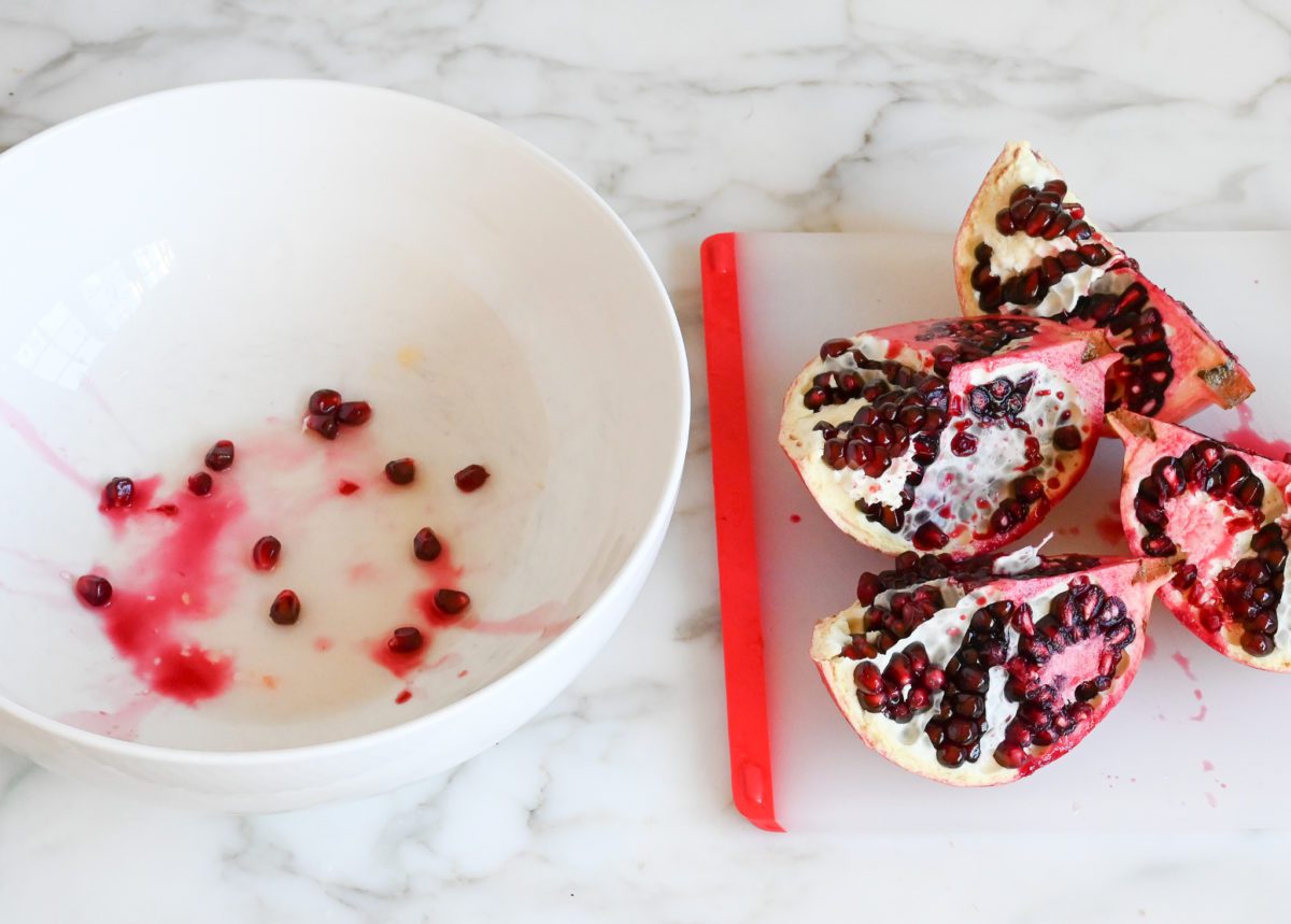 pulling apart pomegranate quarters