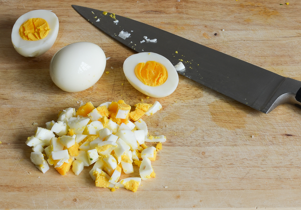 chopping hard-boiled eggs