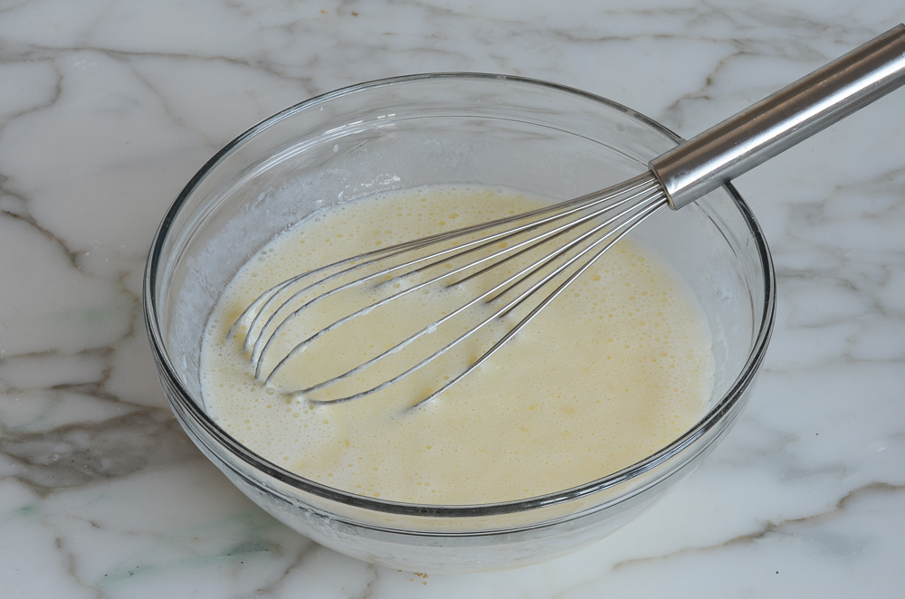 Bowl of whisked buttermilk mixture.