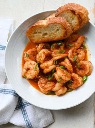 Bread in a bowl with New Orleans-inspired barbeque shrimp.