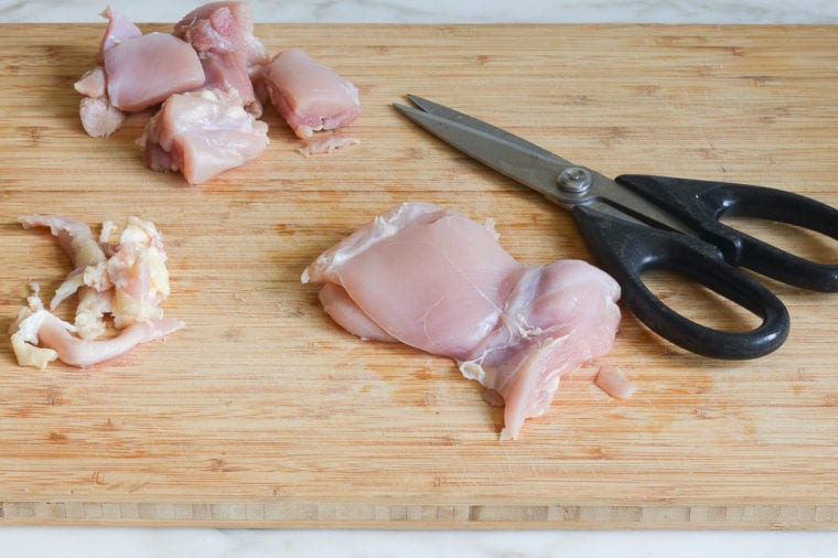 trimming and cutting chicken thighs